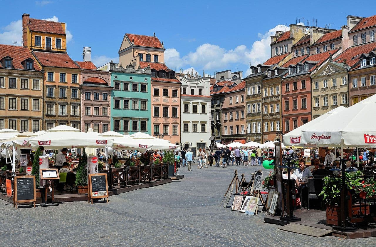 Colourful townhouses and outdoor cafes in Warsaw's Old Town Market Square